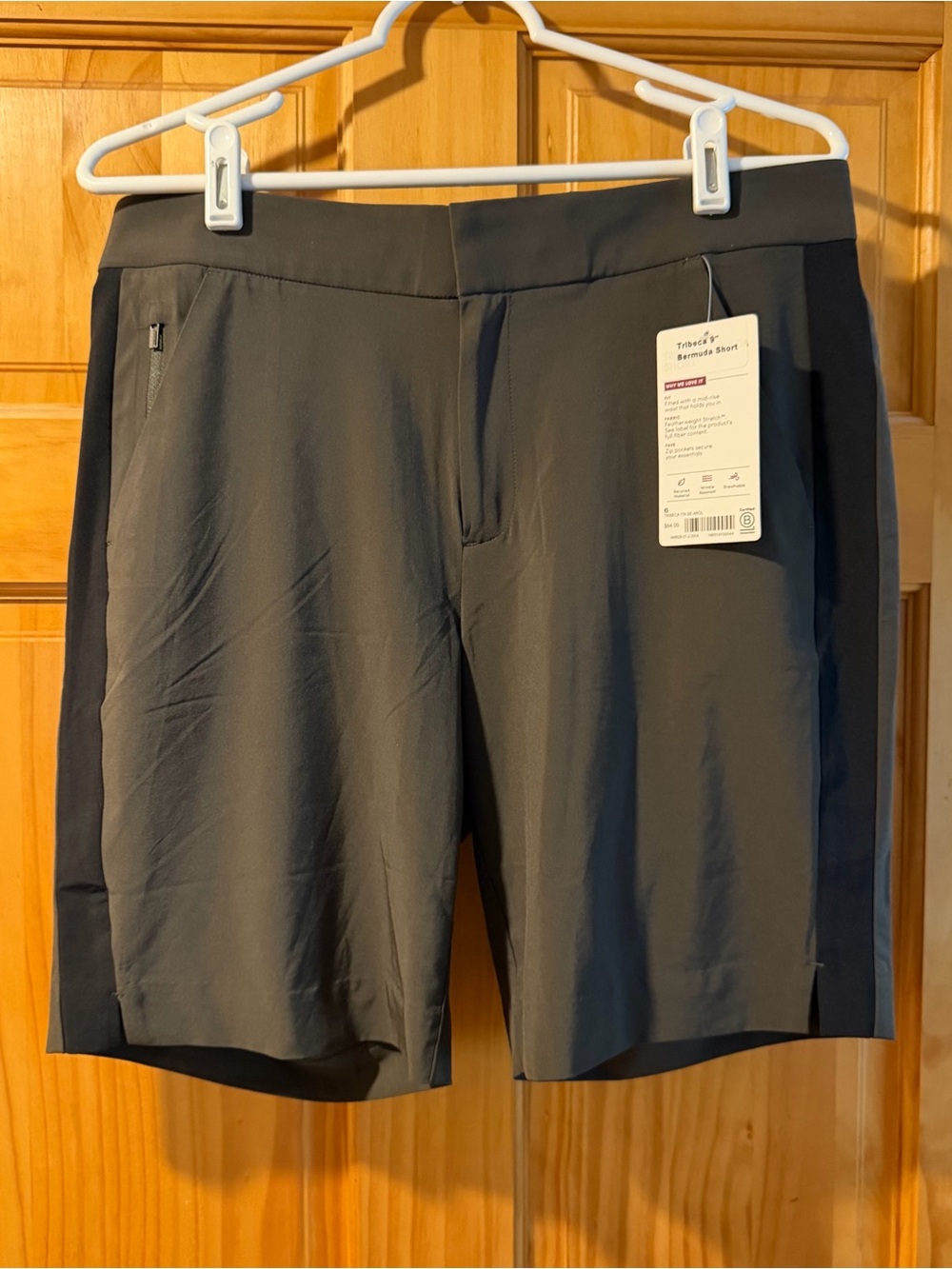 Athleta Arbor Olive Tribeca 9" Bermuda short w/ Black Pinstripe. Size 6 NWT